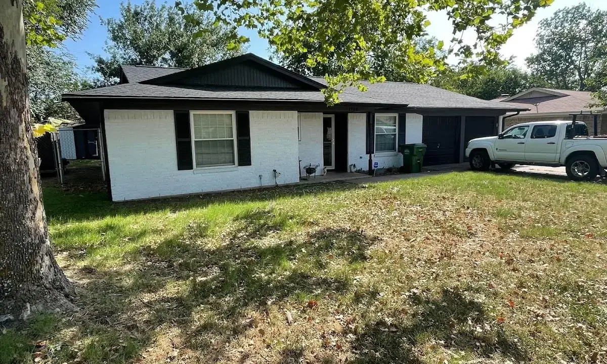 Professional roofing crew working on a residential roof in New Braunfels